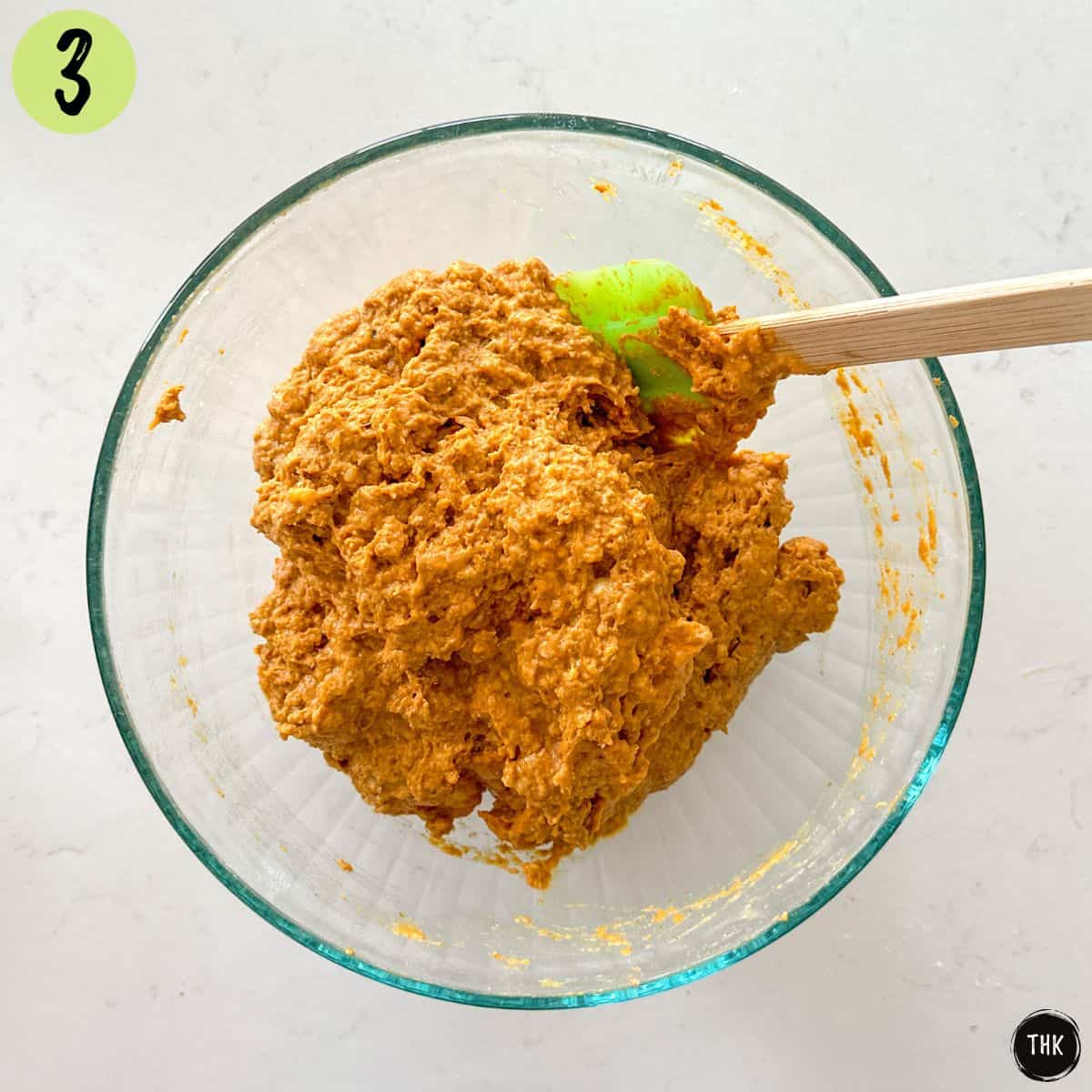 Pumpkin banana bread batter in large glass bowl.