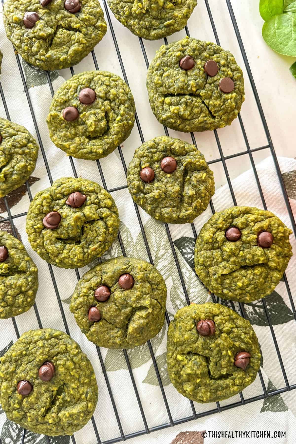 Green cookies with chocolate chip eyes and zig zag mouths.