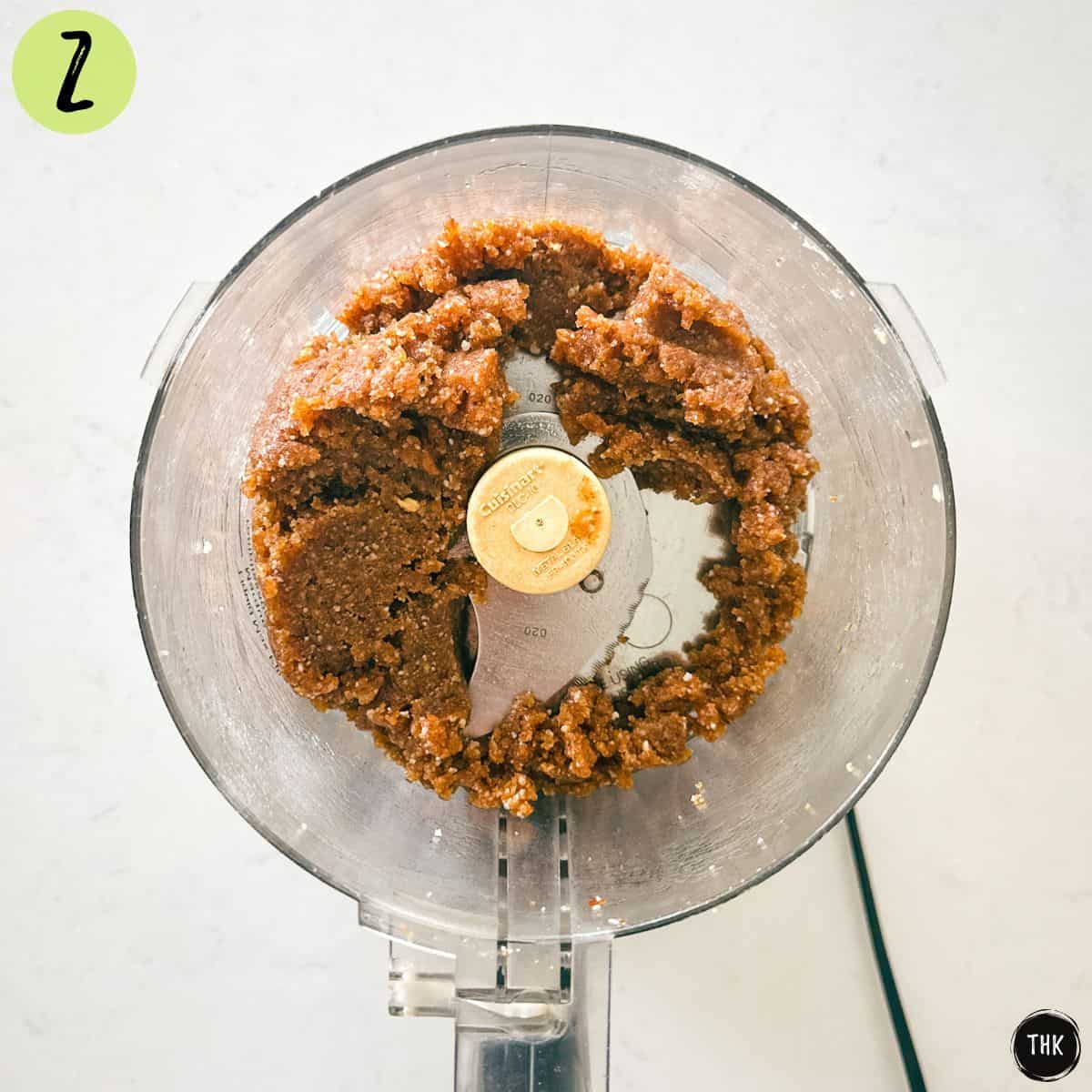 Salted caramel bliss ball batter inside food processor.