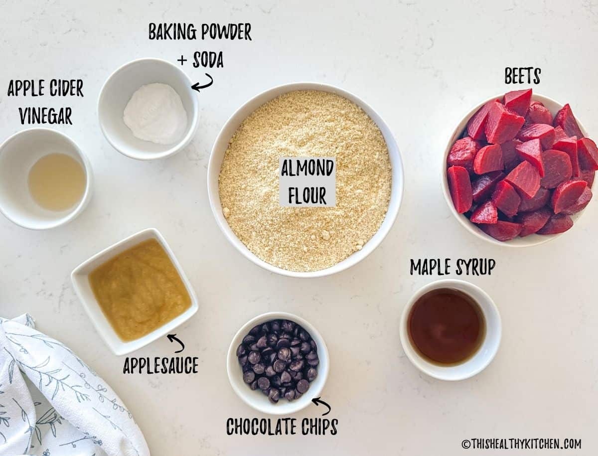 Ingredients to make beet muffins in prep bowls on counter top.