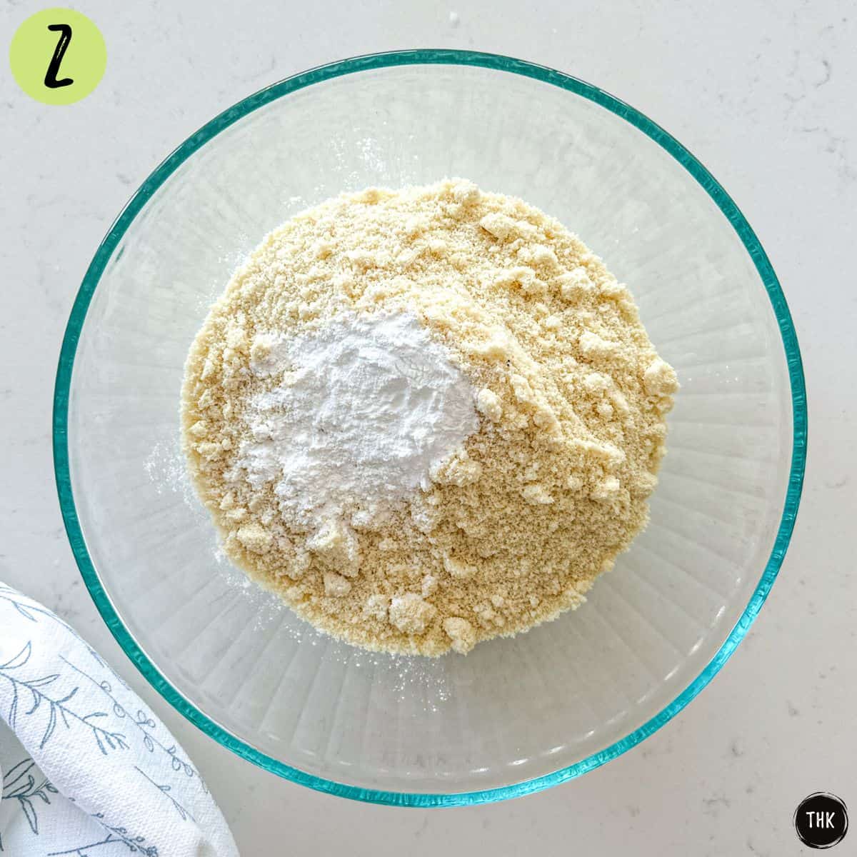 Large bowl of almond flour and baking powder on top.