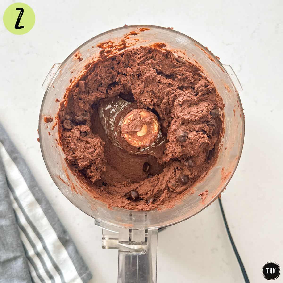 Double chocolate chip cookies batter inside food processor.