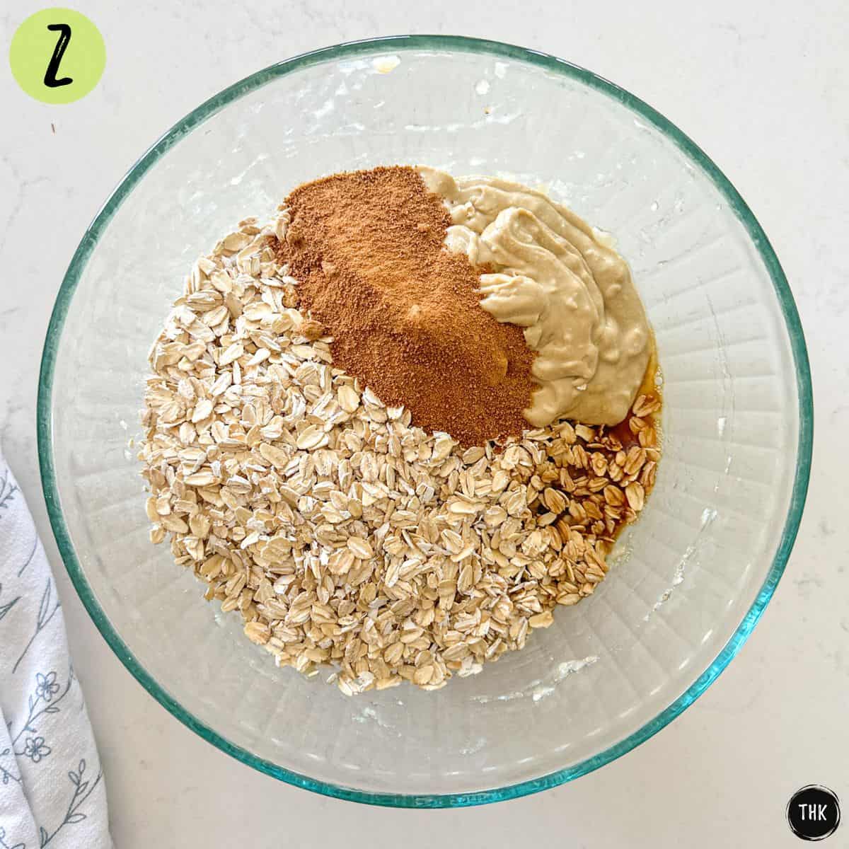 Large bowl with oats, sugar, tahini, vanilla and mashed banana.