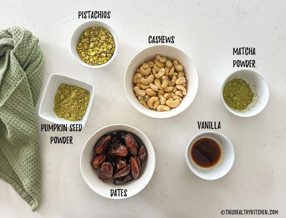 Ingredients needed to make matcha balls in prep bowls on kitchen countertop.