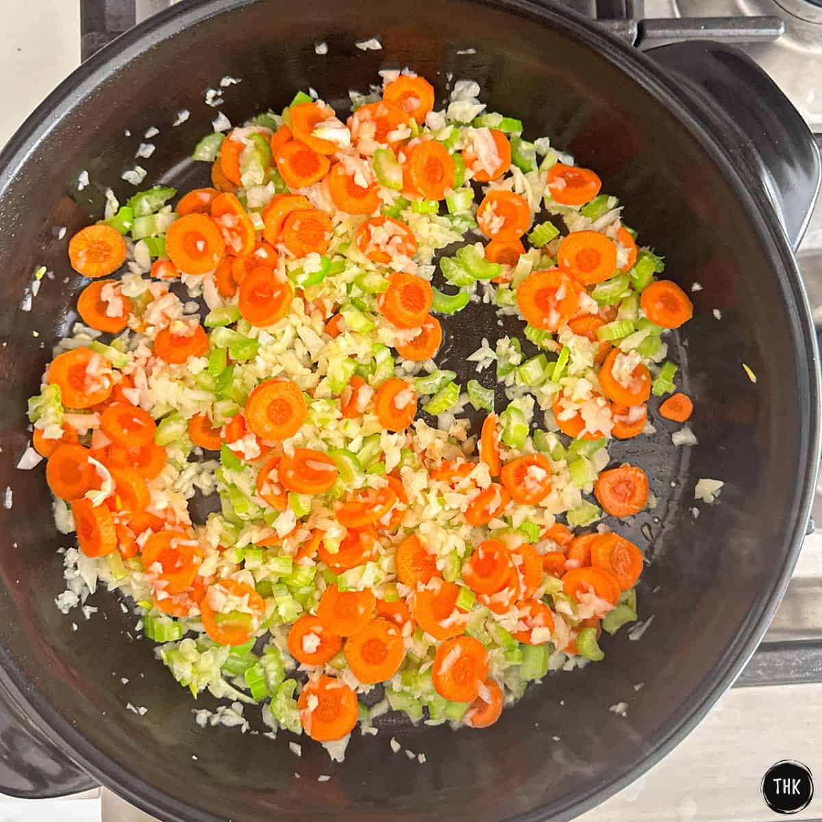 Sautéed onion, garlic, carrot and celery inside deep skillet.